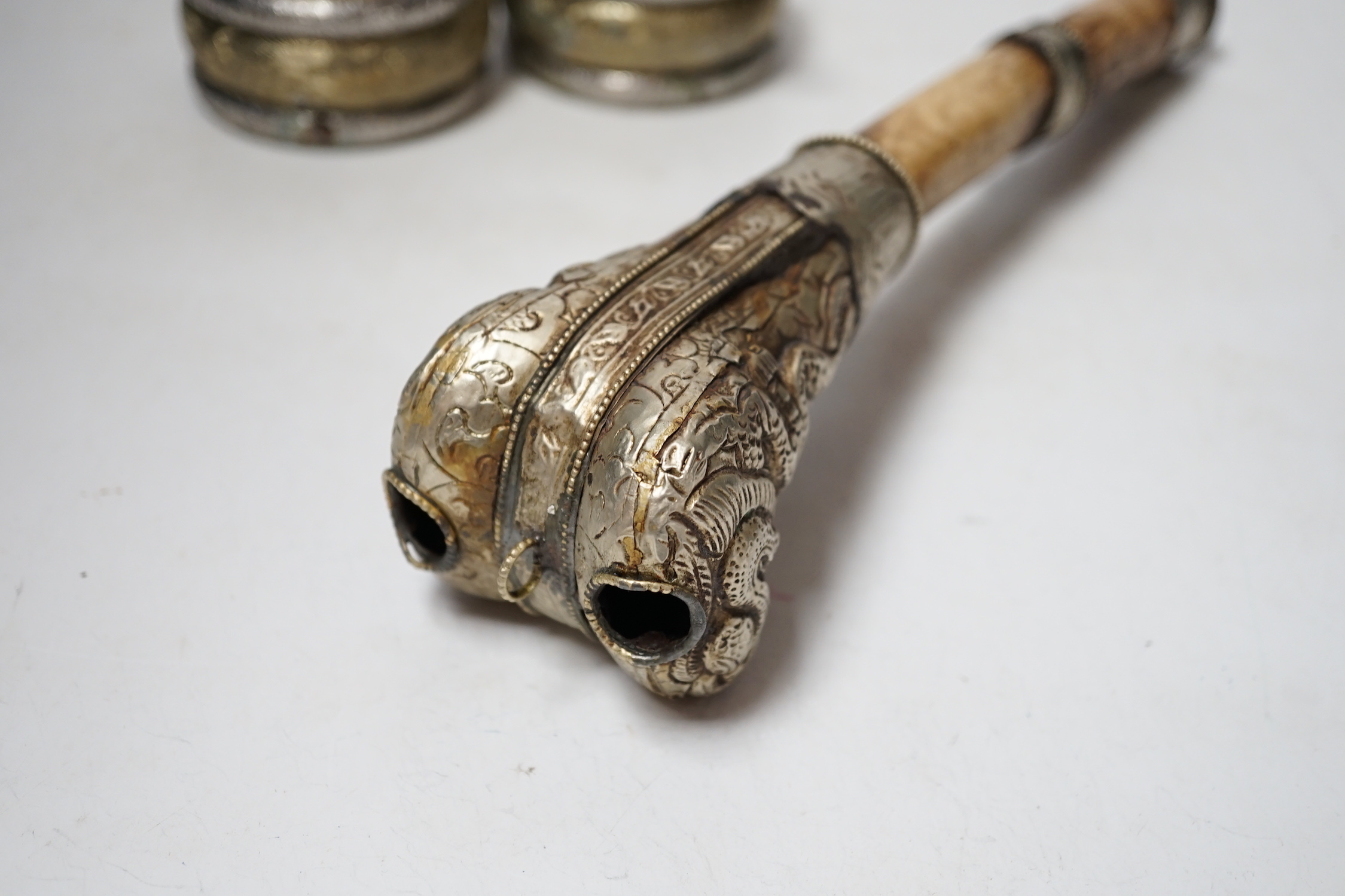 A pair of Georgian silver sugar tongs, a mounted bone implement and a pair of mixed metal bangles.